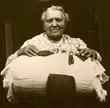 A Mrs Sarah Harman displaying the pillow and bobbins