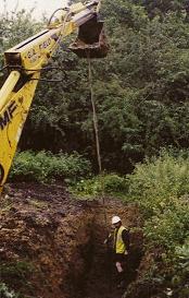 Obtaining soil sample by auger, with the aid of an Excavator