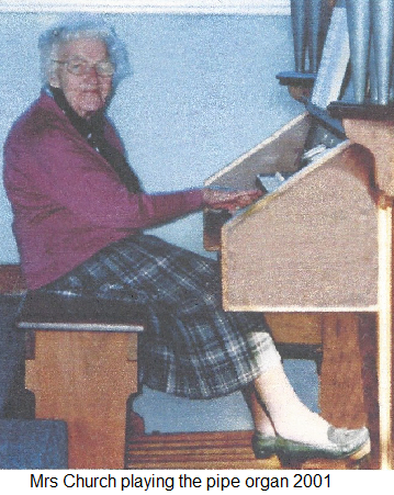 Mrs. Church playing the pipe Organ 2001