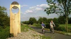 Cyclists passing 	 one of the many interesting resting places