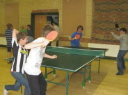 Youngsters playing tennis